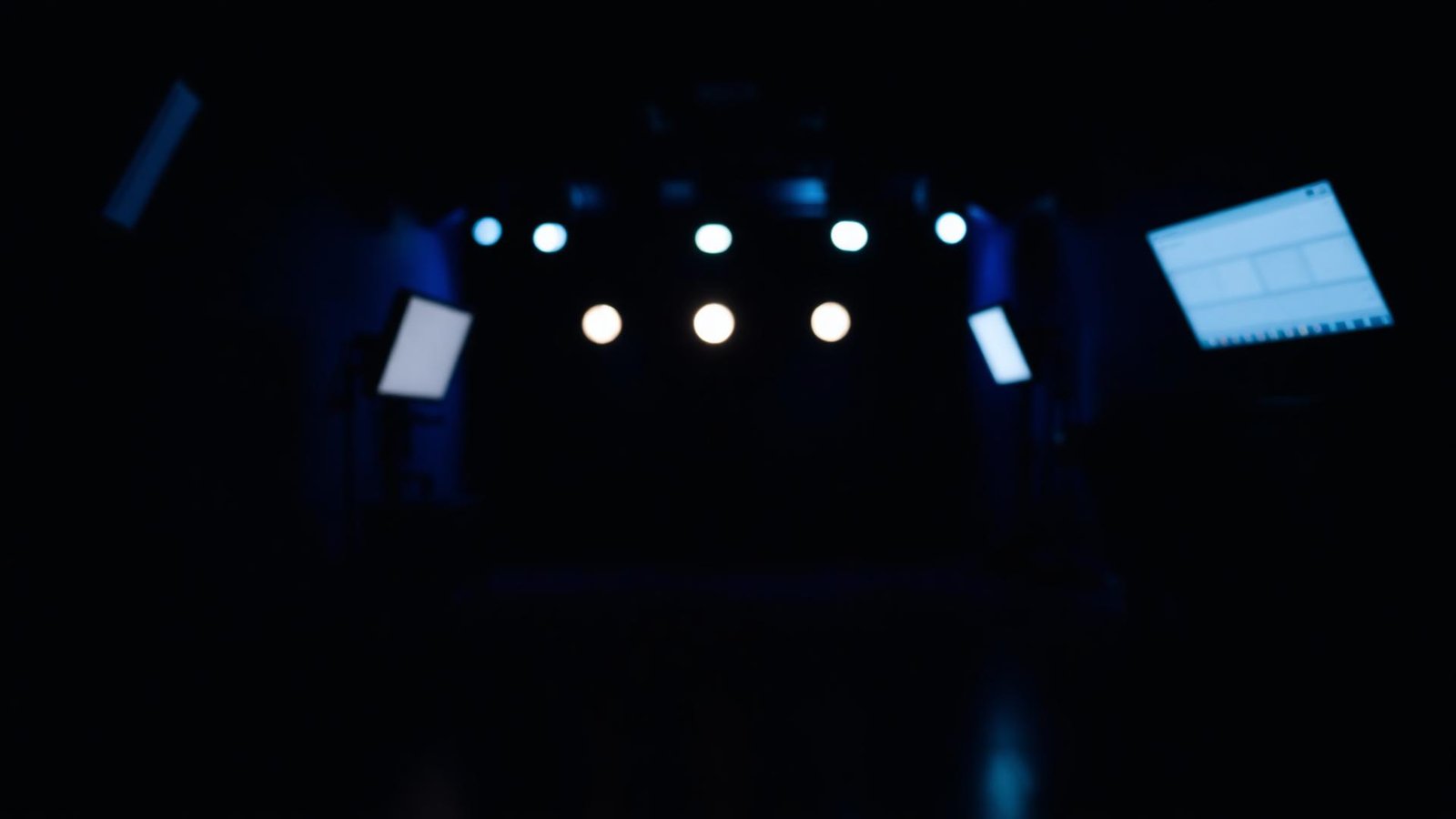 Cinematic production studio lit in deep blue